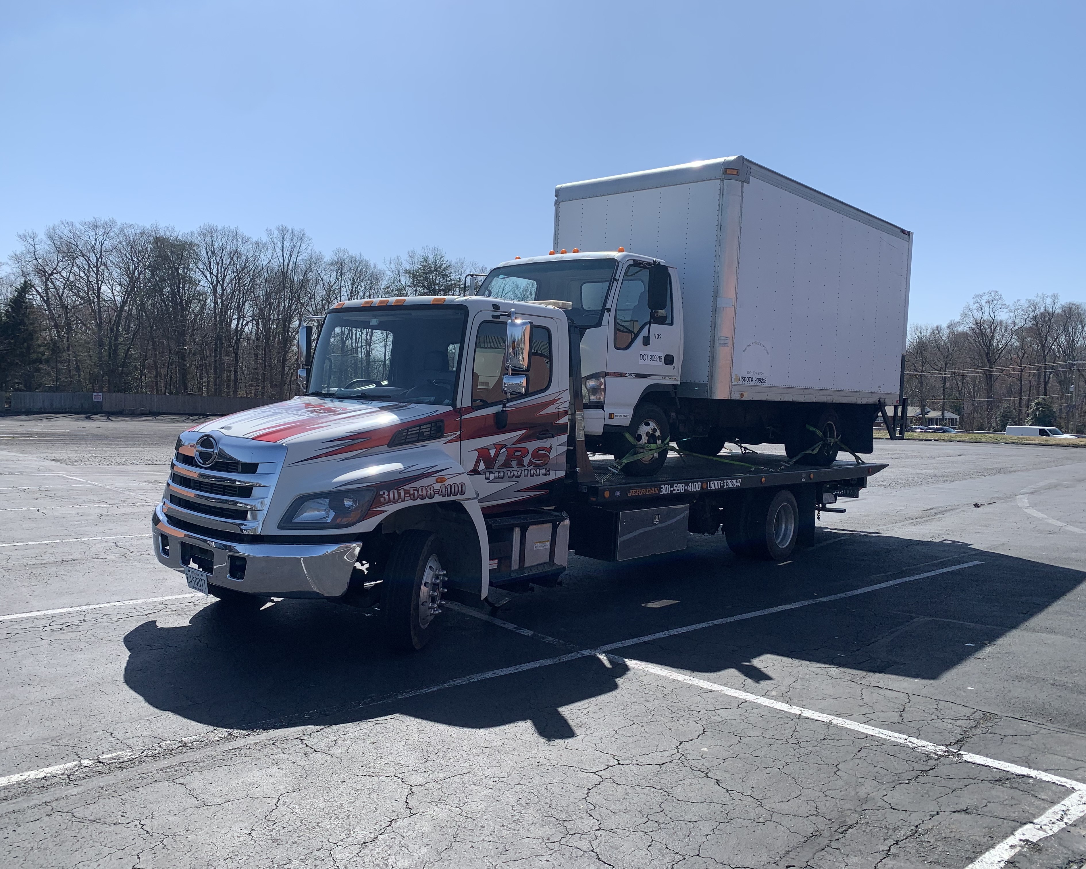 Large Truck on Flatbed Tow Truck